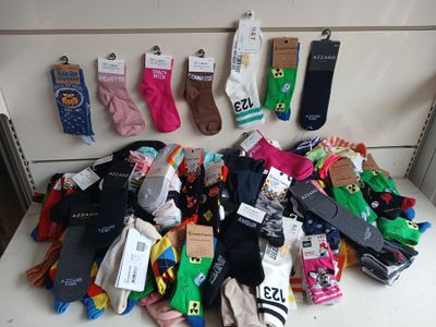 many pairs of socks that are on a table