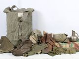 a large bag of military items on a white table