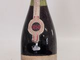 a bottle of wine that is sitting on a table