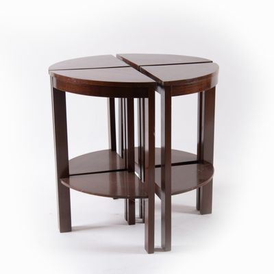the two tables are made out of wood and have a circular shape