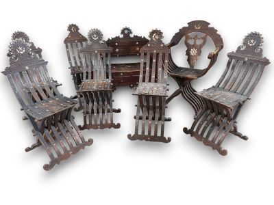 six chairs and a table with a clock on it