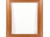 an empty wooden picture frame on a white background