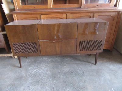 a wooden cabinet with a glass door and a glass door