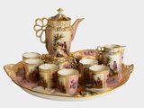 une image représentant un service à thé avec des tasses et des soucoupes