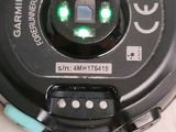 a close up of a camera with a green light on it