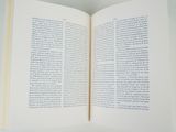 a open book on a table with a white background