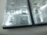 a lot of silver coins in a plastic case