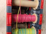 a picture of a spool of thread and a spool of thread on a rack