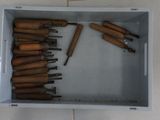 a lot of tools in a box on the floor