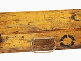 an old wooden box with metal handles on a white background