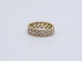 a yellow gold ring with diamonds on a white background