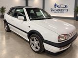 a picture of a white car in a showroom