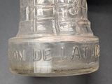 a glass bell that is sitting on a table