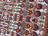 an oriental rug is displayed on a table in a room