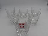 four glasses on a table with a price tag on them