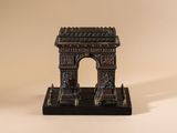 an image of a small statue of a building on a table