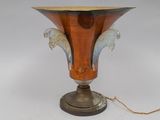 a vase that is sitting on a table with a chain around it