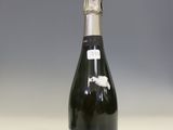 a bottle of wine that is sitting on a table