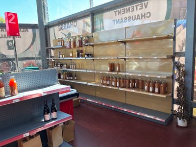 many bottles of wine on the shelves in the store