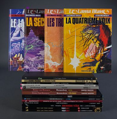 several books are stacked on top of each other on a table