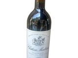 a bottle of wine that is sitting on a table