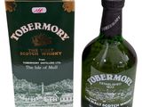 an image of a bottle of whisky next to a box