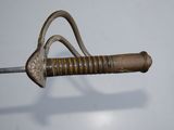 a close up of a sword with a handle on it