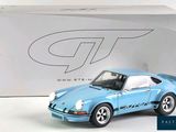 a toy car that is sitting in front of a box