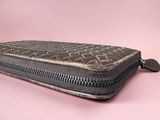 an image of a wallet with a zipper on a pink background