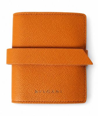 a small orange leather wallet with a card holder
