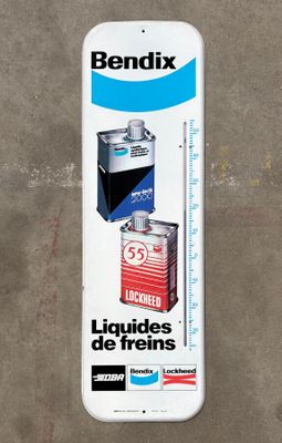 a white skateboard with a picture of a can of liquid on it