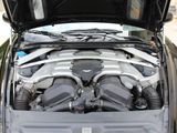 a car engine with its hood open on the street