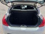 the back of a car with its trunk open in a parking lot