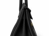 a black handbag on a white background