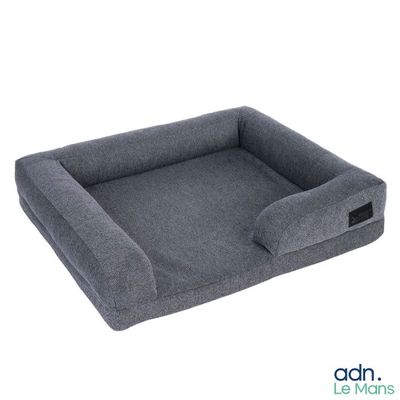 a grey dog bed with a large cushion on top of it