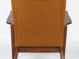 an orange chair with a wooden frame and arm rest