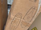 a cardboard box that has a pair of shoes inside of it