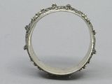 a close up of a silver ring on a table