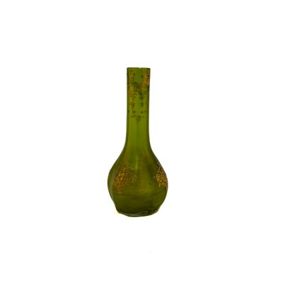 a green vase that is sitting on a white surface