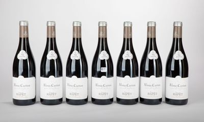 six bottles of wine are lined up in a row