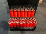 a display case with a lot of red candles in it