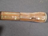 a wooden stick that has a piece of wood on it