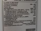 a label on the back of a white refrigerator