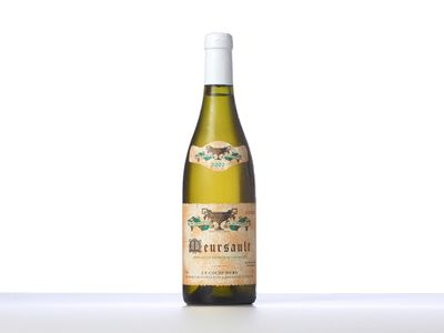 a bottle of white wine sitting on top of a table