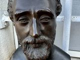 a statue of a man with a beard and a beard