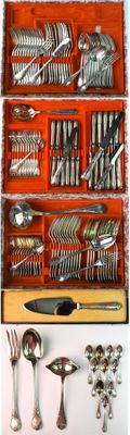 many different types of silverware in a wooden box