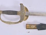 a sword and a knife on a white surface