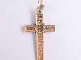 an image of a gold cross on a white background