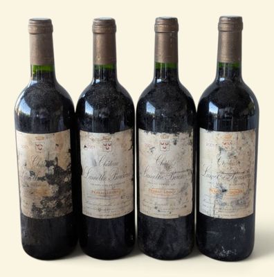 three bottles of wine are lined up on a white surface