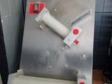 a machine that is sitting on top of a wooden table